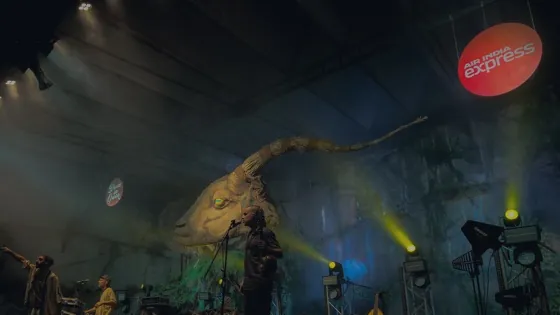 A performer lit against the night