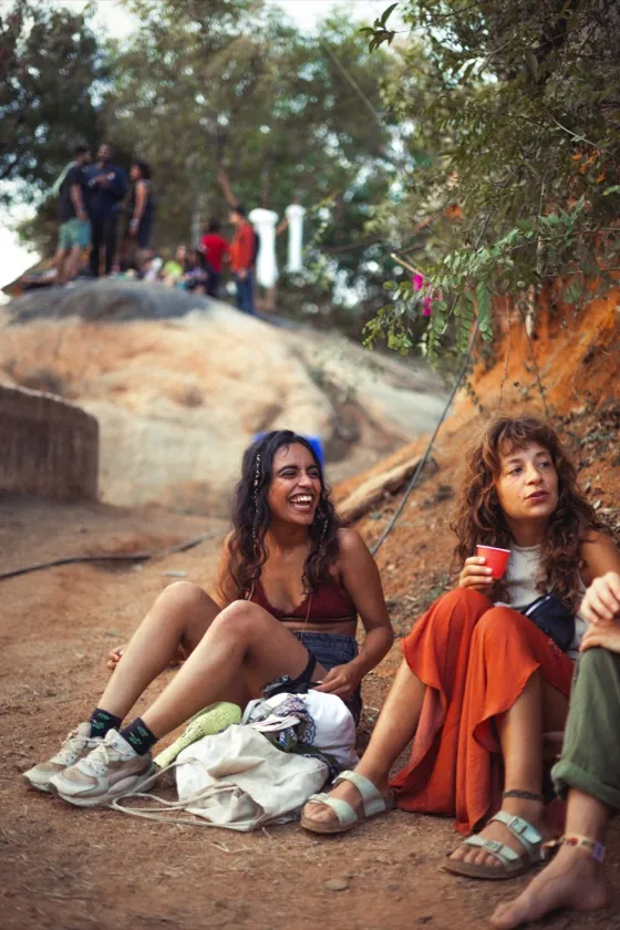 Friends sitting together on the hillside