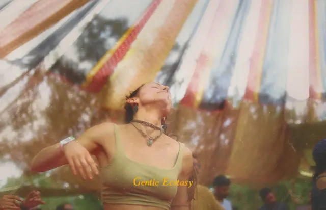 Gentle ecstasy. A dancer with her head thrown back under a striped canopy.